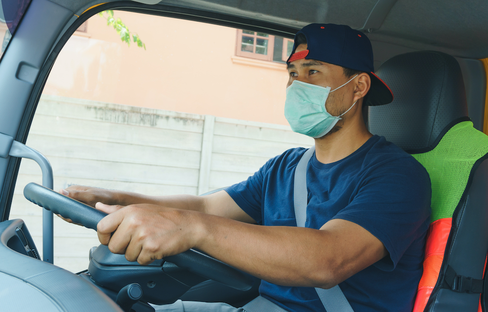 asian truck driver with mask in post-pandemic world
